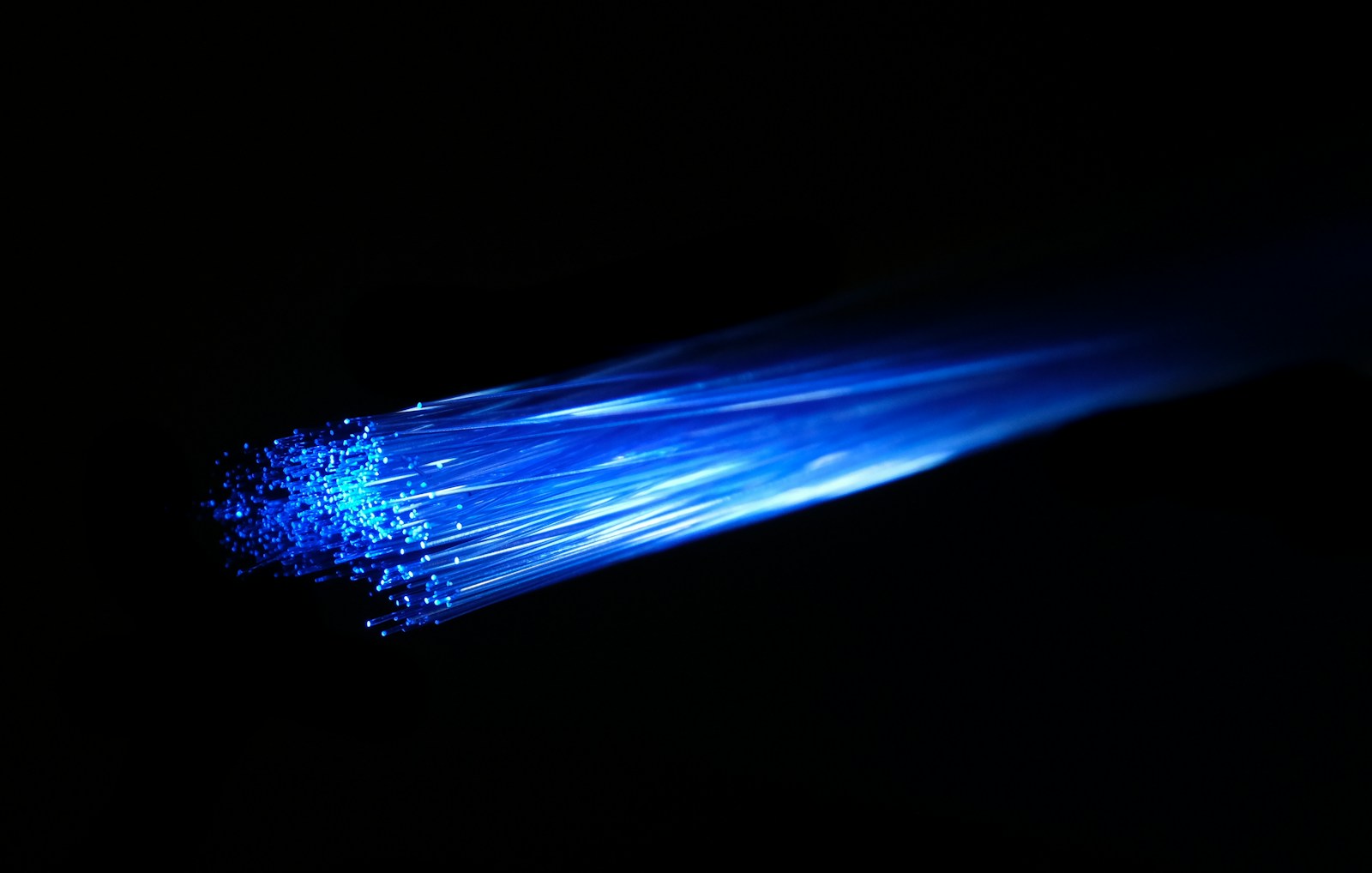 Blue and white fiber optic light visualizing agent-to-agent network communication